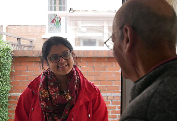 Woman smiling at a man
