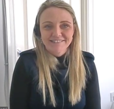 Portrait of Karla Overington wearing a headset and smiling