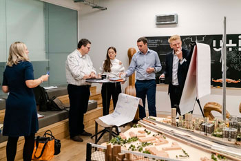 Photo of people with a model town - OPE photo