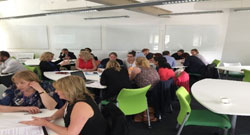 The North Midlands people sitting at desks photo