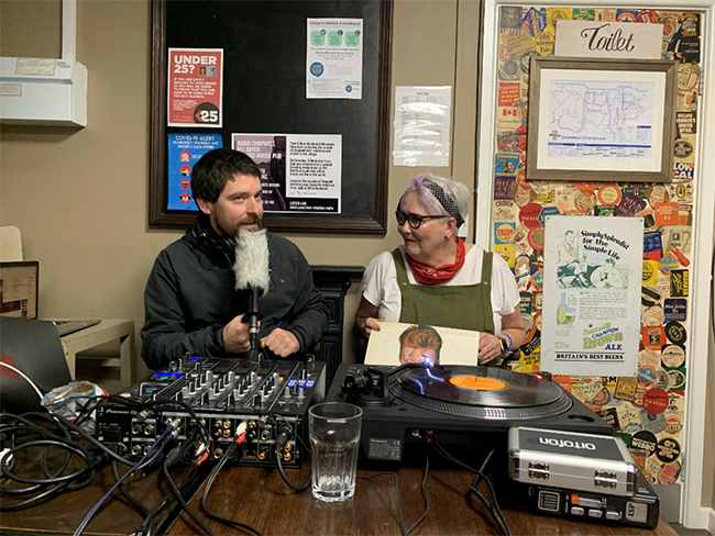 A lady and member of staff doing a live radio broadcast in The Redhouse Pub