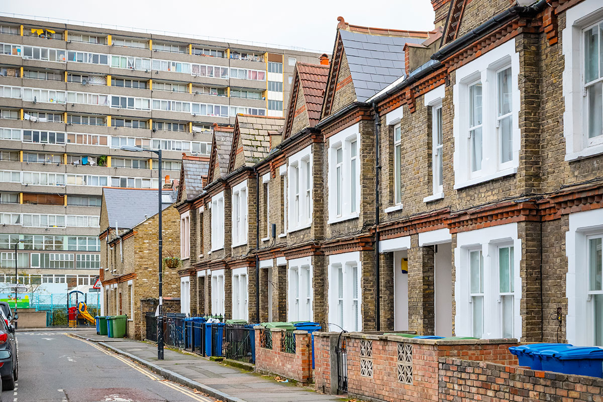 Row of terraced houses with block of flats in background