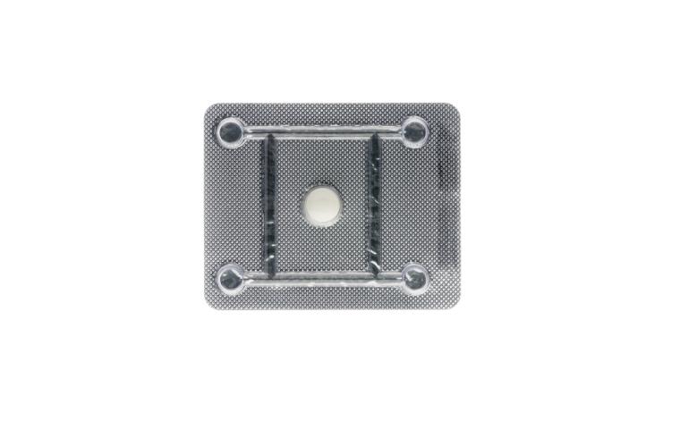 Silver tablet case with one white round pill.