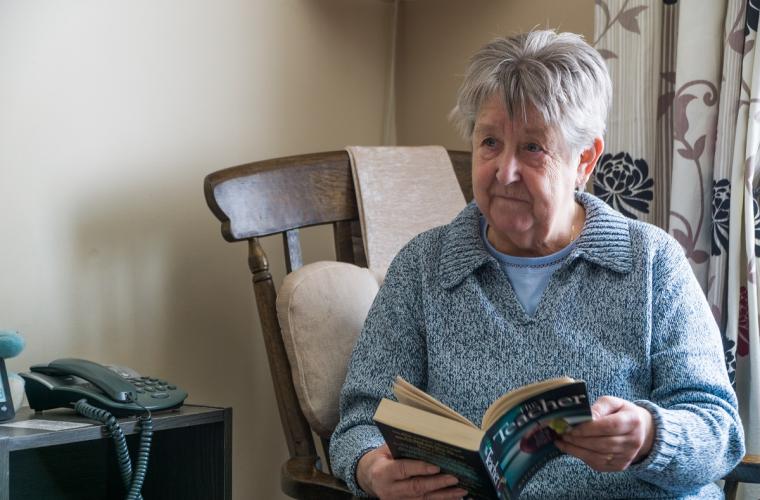 Old person reading a book