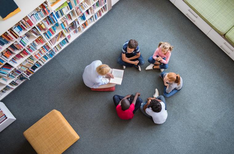Children listening to a story in a library