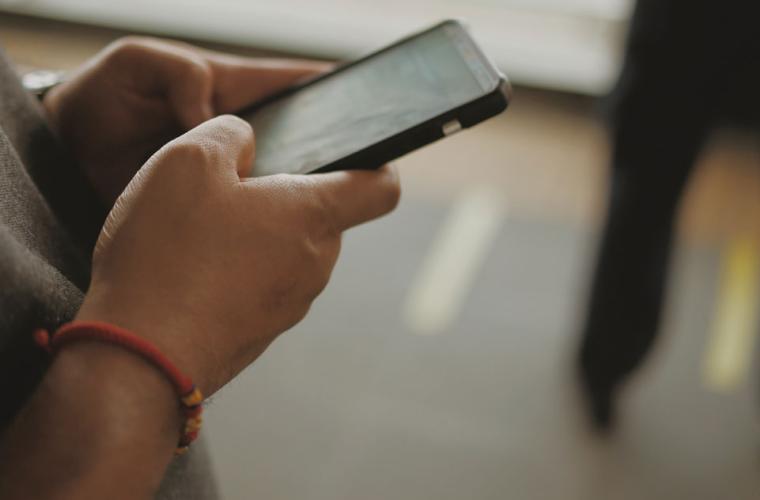 Hands holding a mobile phone