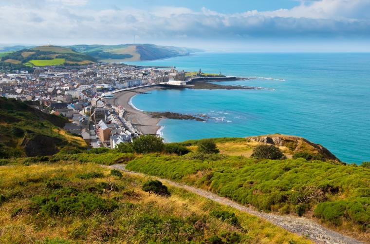 Wide shot of a coastal town on a sunny day