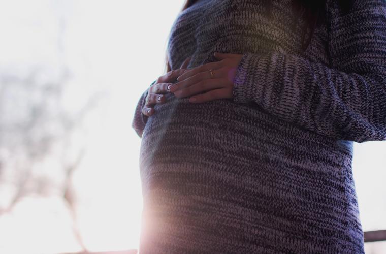 Pregnant stomach with sunshine