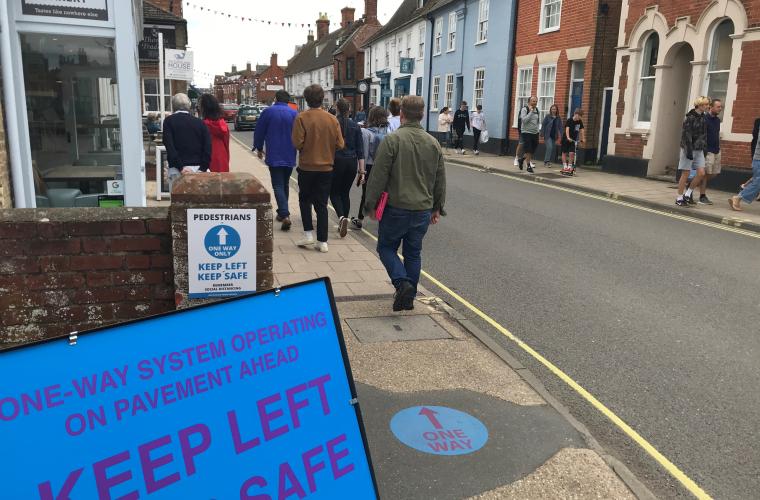 High street in Suffolk with COVID-19 sign