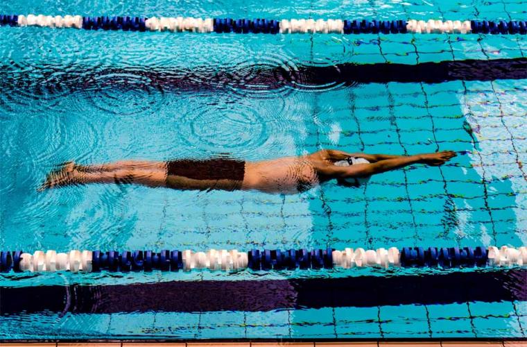 man swimming in a pool