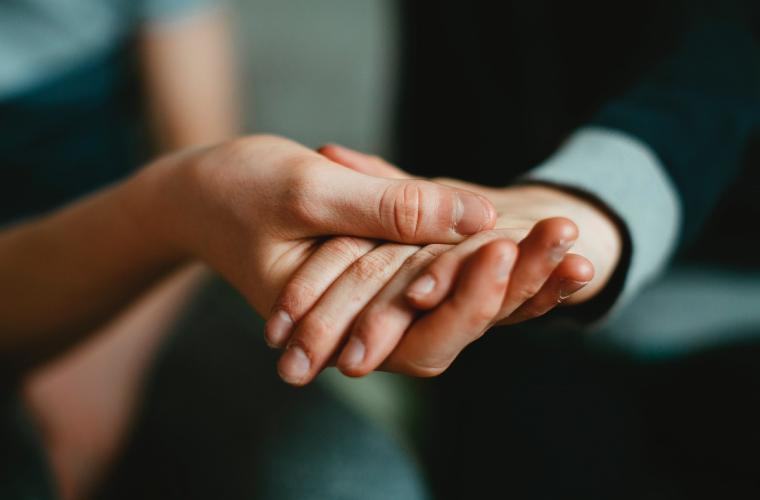 people touching hands