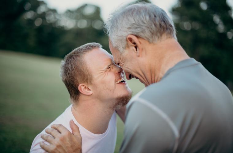 Image of two men smiling 
