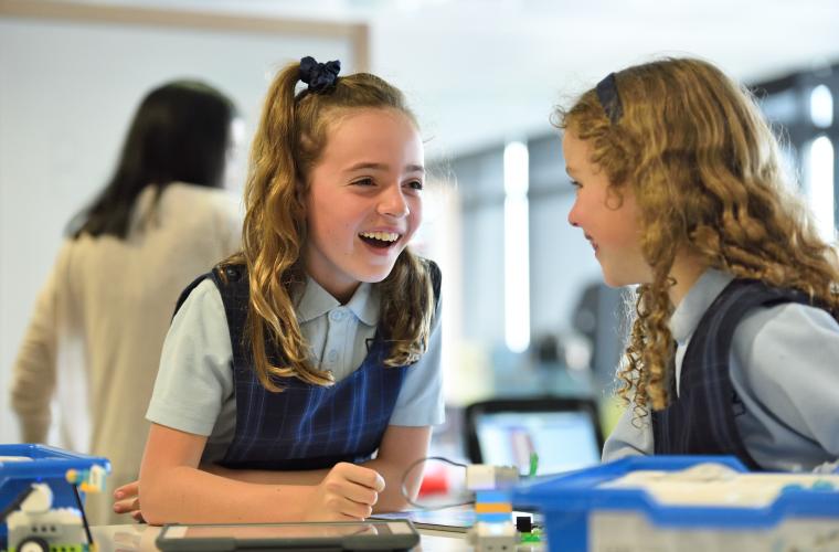 School girls sitting at desk