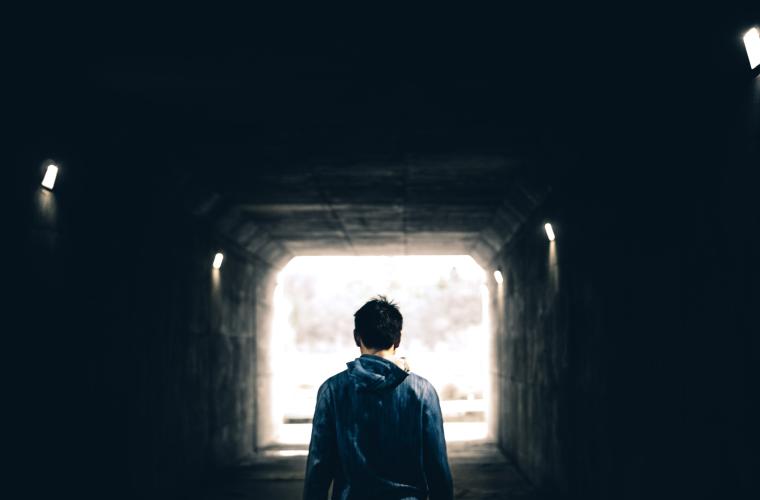 Young man in tunnel
