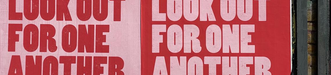 Outdoor poster with a positive message: Be Kind. Let's look out for one another.