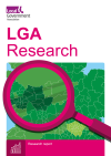 LGA research with a magnifying glass looking at a zoomed in map