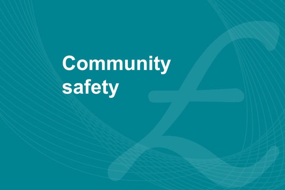 Blue background with a british poud sign and the text 'community safety'