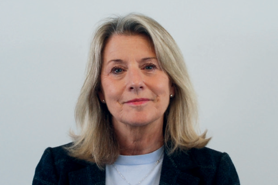 Debbie Ward a blonde lady looks towards the camera