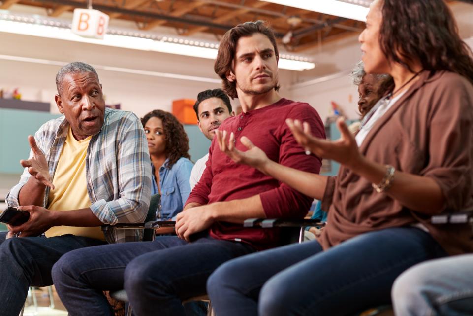 Group of people in meeting in community centre