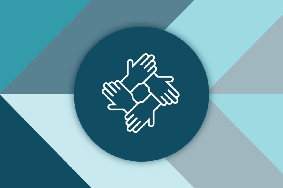 Four hands joined together