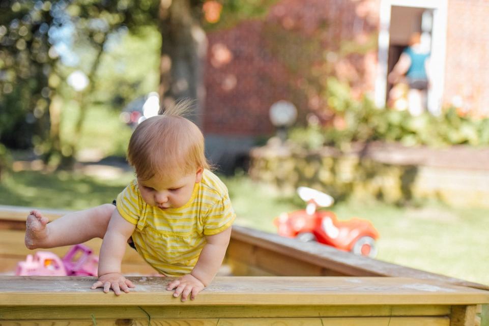 Photo of toddler in sandbox